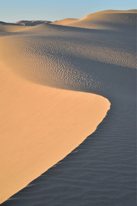 Scenic view of desert against sky during sunset