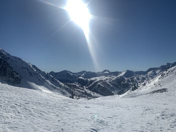 Scenic view of snowcapped mountains against sky