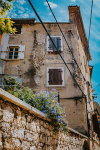 Low angle view of old building against sky