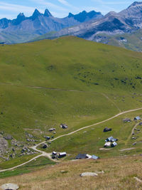 Scenic view of mountains against blue sky