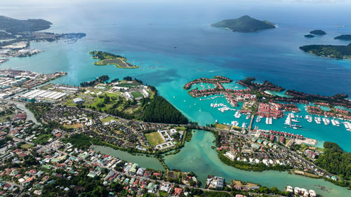 High angle view of townscape by sea