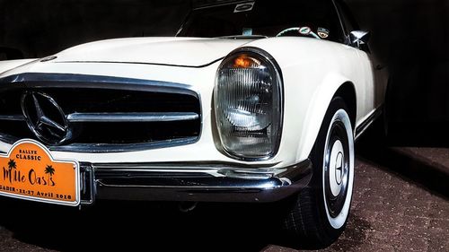 Close-up of vintage car on road