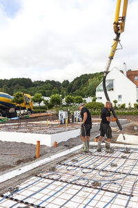 Workers preparing foundations