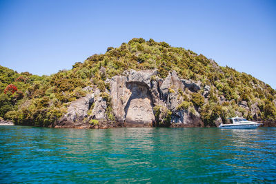 Scenic view of sea against clear blue sky