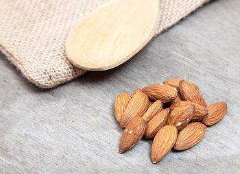 Close-up of almonds on wooden table