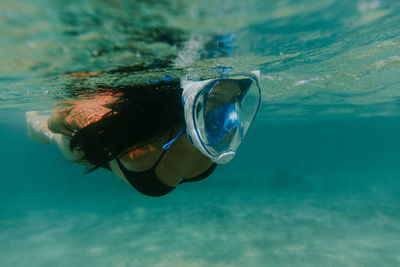 Full length of woman diving in sea