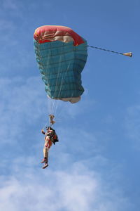 Low angle view of kite flying against sky