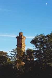 Low angle view of bell tower against blue sky