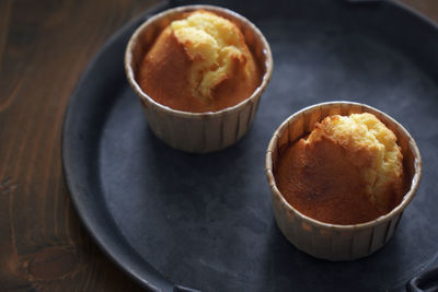 There are several delicious lemon honey cupcakes just made on the table