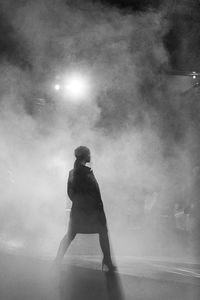 Man looking at camera while standing in fog