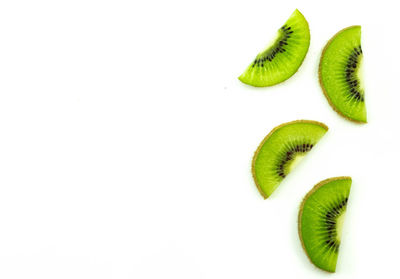 Close-up of fruits over white background