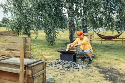 Rear view of man sitting on chair