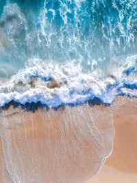 Close-up of sea waves splashing on shore