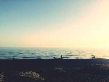 Scenic view of beach against clear sky