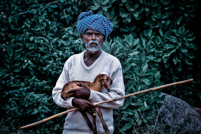 Portrait of man sitting outdoors