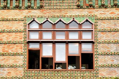 Close-up of brick wall with windows