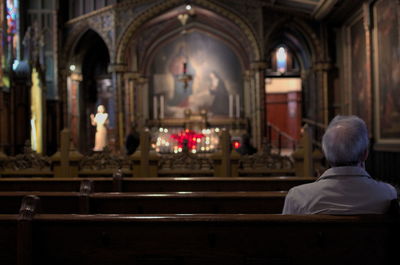 Rear view of man sitting in church