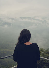 Rear view of woman standing at observation point