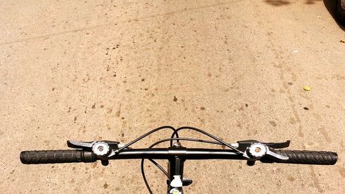 Close-up high angle view of bicycle on road