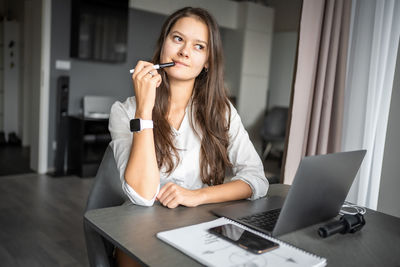 Businesswoman working at table