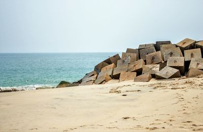 Scenic view of beach against clear sky