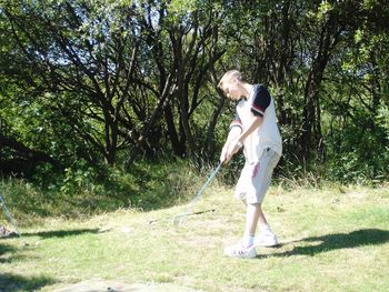 Side view of man standing on land