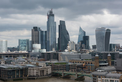 Modern buildings in city against sky