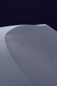 High angle view of snow covered land against sky