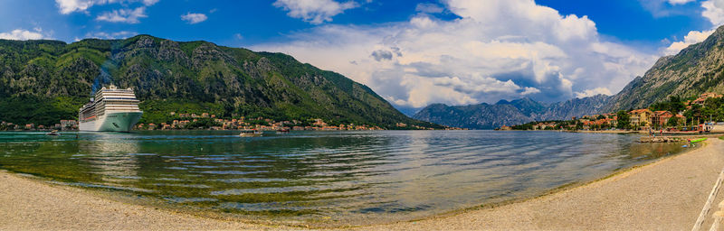 Scenic view of lake and mountains against sky