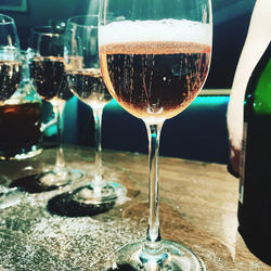 Close-up of wine glasses on table