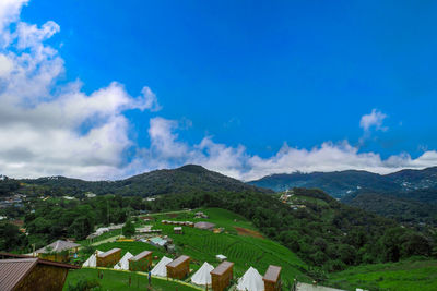 Scenic view of mountains against blue sky