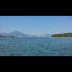 Scenic view of calm sea against clear sky