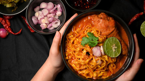 Midsection of woman holding food