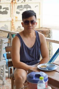 Portrait of man sitting at restaurant table