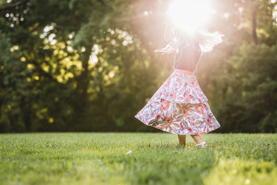 Rear view of girl with umbrella