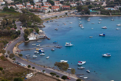 High angle view of boats moored at harbor