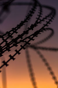 Close-up of text on metal fence