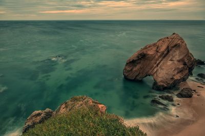 Scenic view of sea against dramatic sky