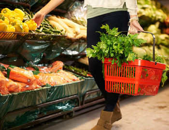 Midsection of man preparing food for sale