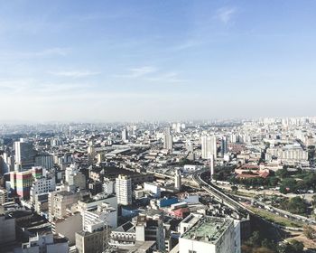 High angle view of city buildings against sky
