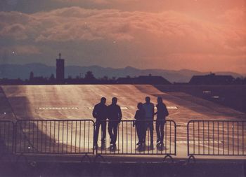 Silhouette of people at sunset