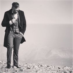 Man standing on mountain during winter