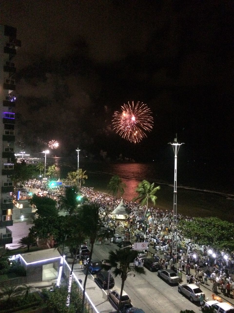 illuminated, night, celebration, firework display, arts culture and entertainment, building exterior, firework - man made object, long exposure, built structure, architecture, exploding, sparks, motion, event, low angle view, glowing, city, celebration event, blurred motion, amusement park