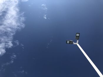 Low angle view of street light against sky