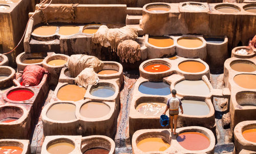 High angle view of man standing at dye industry