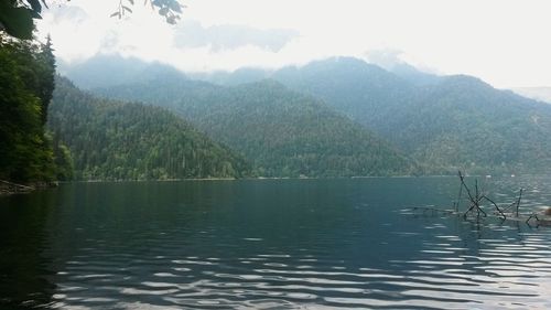 Scenic view of lake with mountains in background