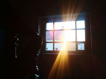Sunlight streaming through window at sunset