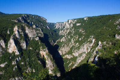 Scenic view of mountains against clear sky