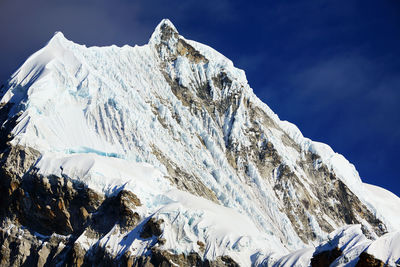 View of snowcapped mountain peak against sky
