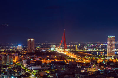 High angle view at night da nang city. central district with illuminated road and a bridge 